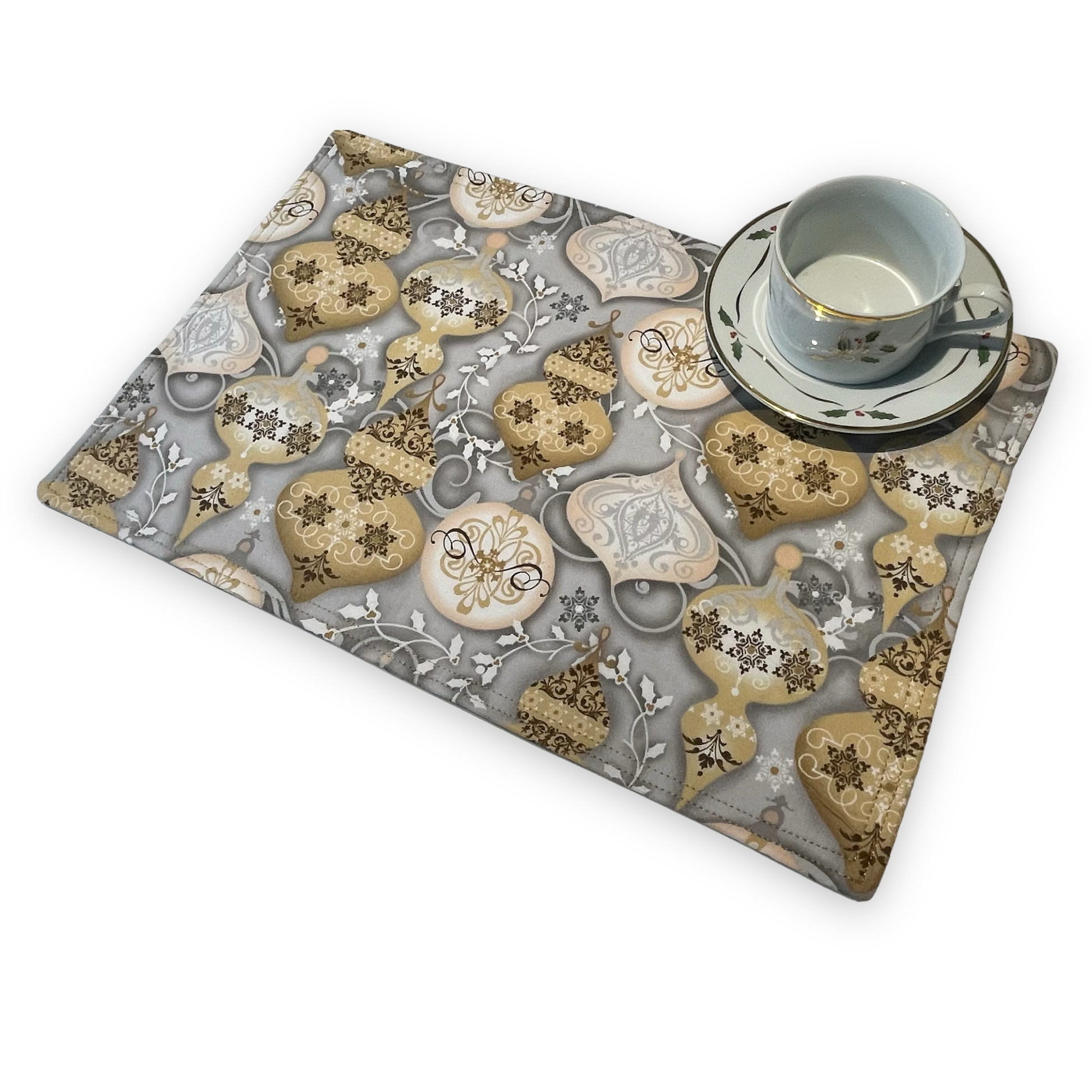 Set of two Christmas Placemats, handmade in Canada Featuring Gold and Cream Christmas Ornaments on one side and Silver Snowflakes on the reverse. Easily dress up your Christmas Kitchen Table with these stylish luxury placemats. Check out all the mix and match decor at Home Stitchery Decor